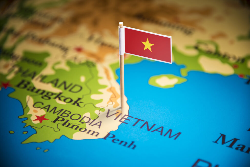 Vietnam marked with a flag on the map.